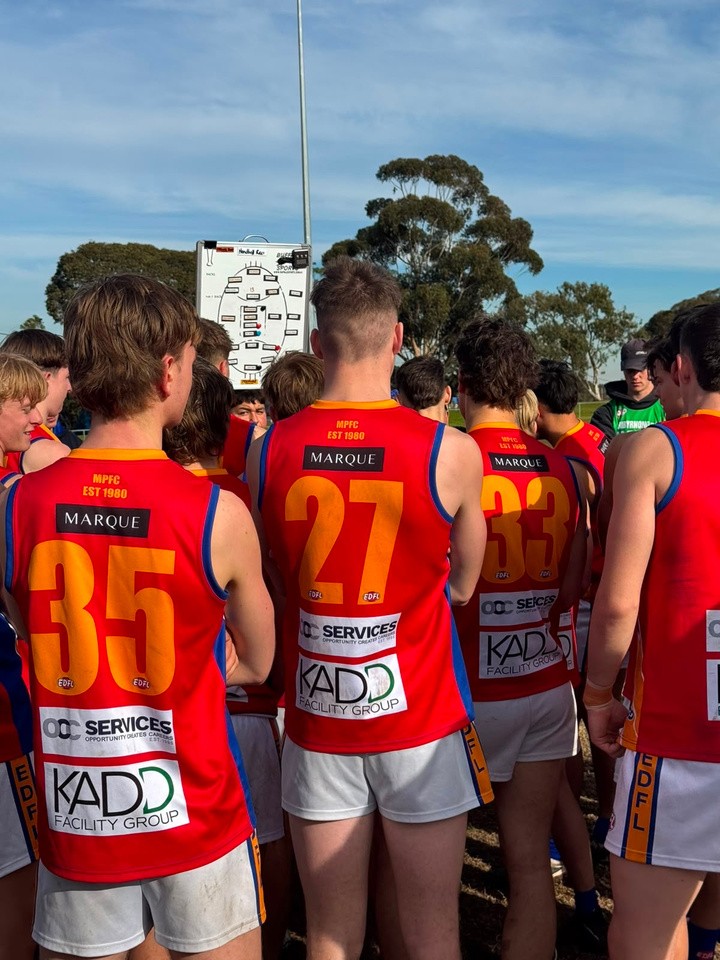 Marby players and coaches discussing the game together